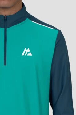 Charge 2.0 1/4 Zip - Aruba/Abyssal -Sport Wear Daily Store Charge 1 4 Zip LAPIS SAILOR BLUE Logo close up Inc reflective detail and Zip